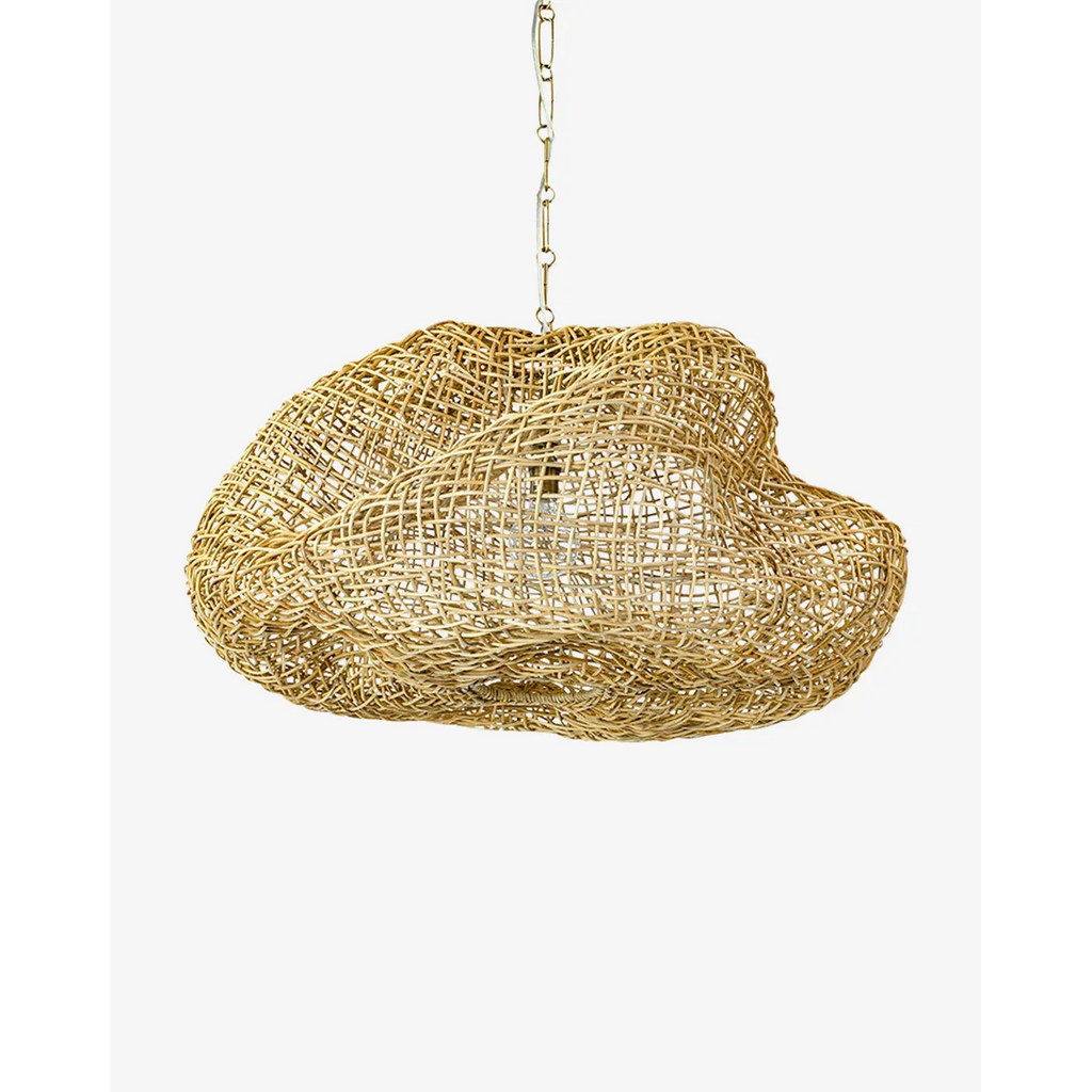 Andorra Wicker Pendant artisan handwoven rattan hanging light with warm dappled glow above dining table in bohemian interior