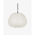 Bayu Pendant Southeast Asian artisan natural organic hanging light with warm airy glow above dining table in bohemian interior