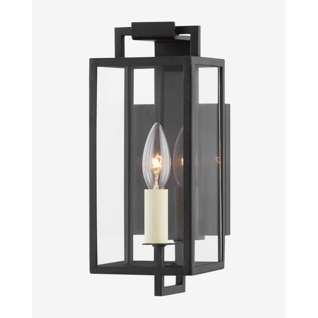 Beckham Wall Sconce Art Deco-inspired stepped chrome wall light with warm ambient glow in glamorous living room interior