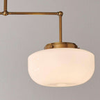 Opal glass globe and satin brass hardware detail — schoolhouse collection
