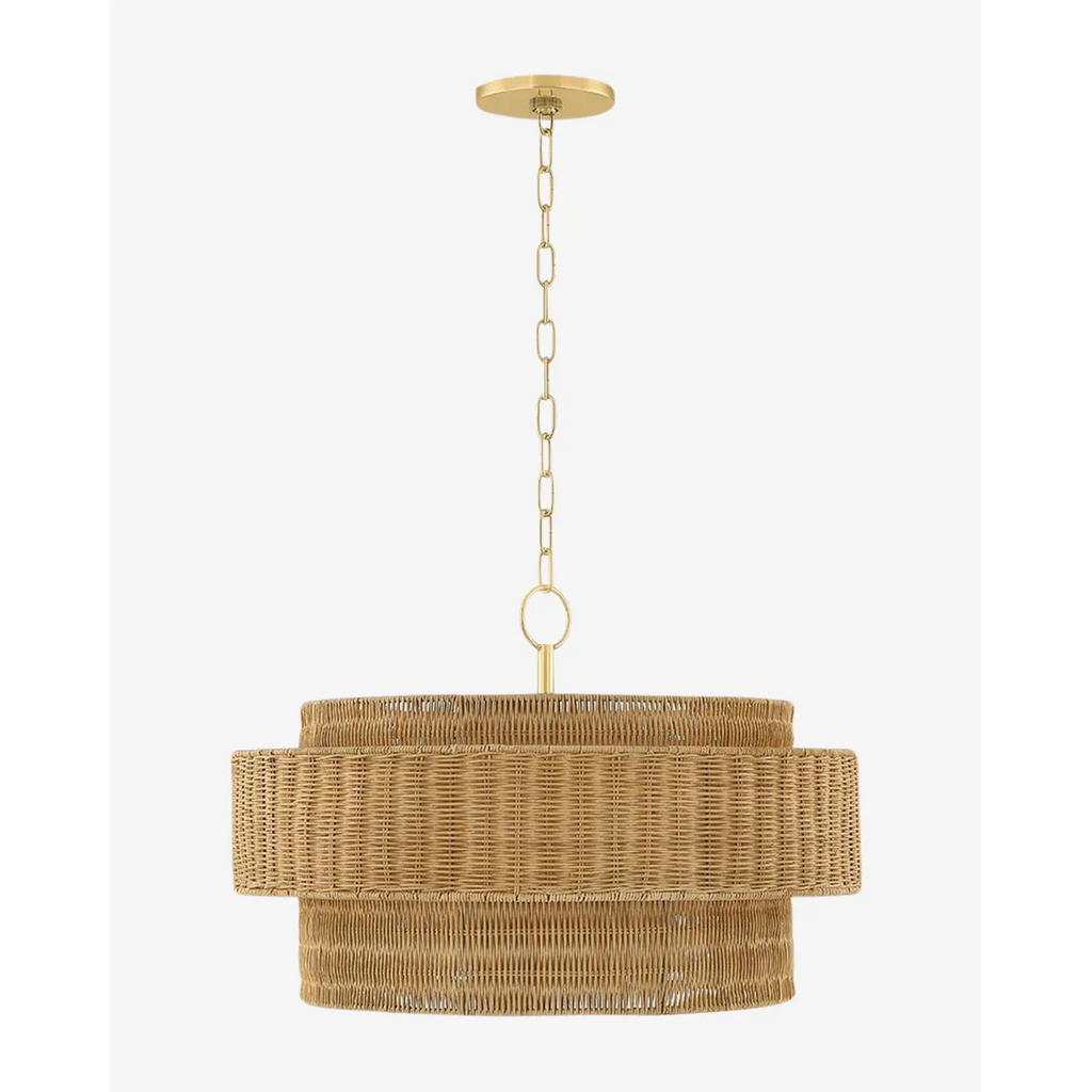 Danica Wicker Pendant handwoven hanging light with warm filtered glow over dining table in bohemian interior