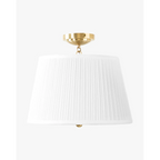 Georgiana Semi-Flush Mount Regency-inspired polished brass ceiling light with warm cascading glow in elegant bedroom interior