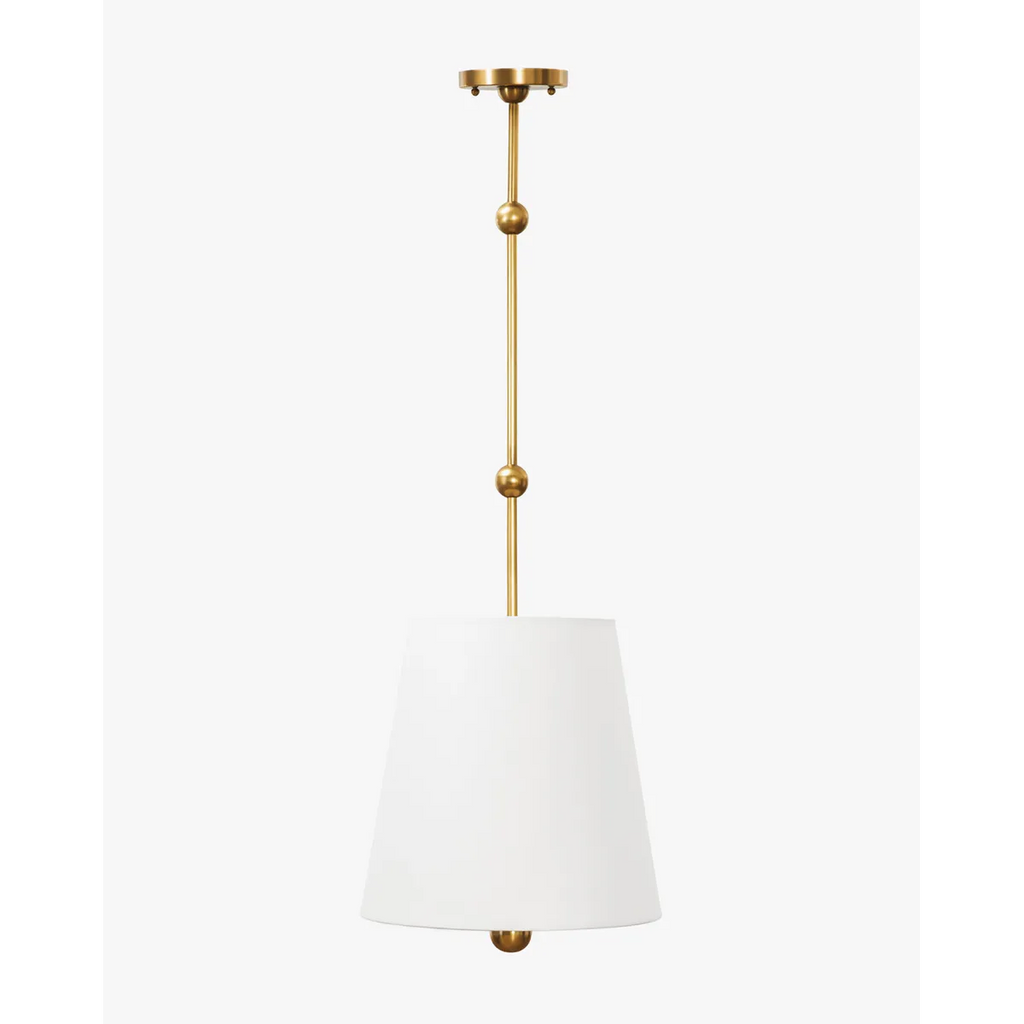 Kipling Pendant colonial-inspired antique brass hanging light with rich warm downlight in elegant study interior