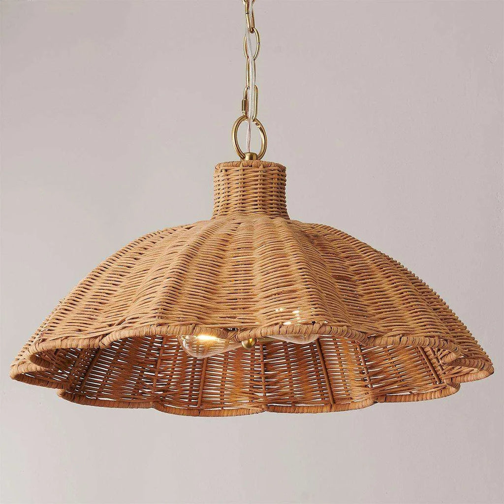 handwoven rattan pendant light with aged brass hardware