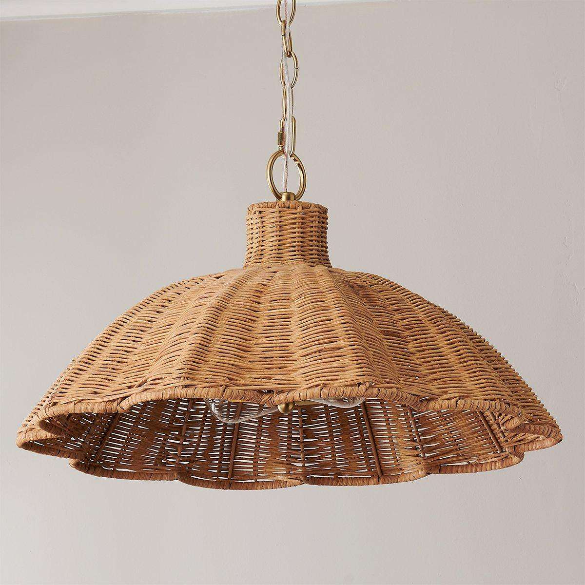 handwoven rattan pendant light with aged brass hardware