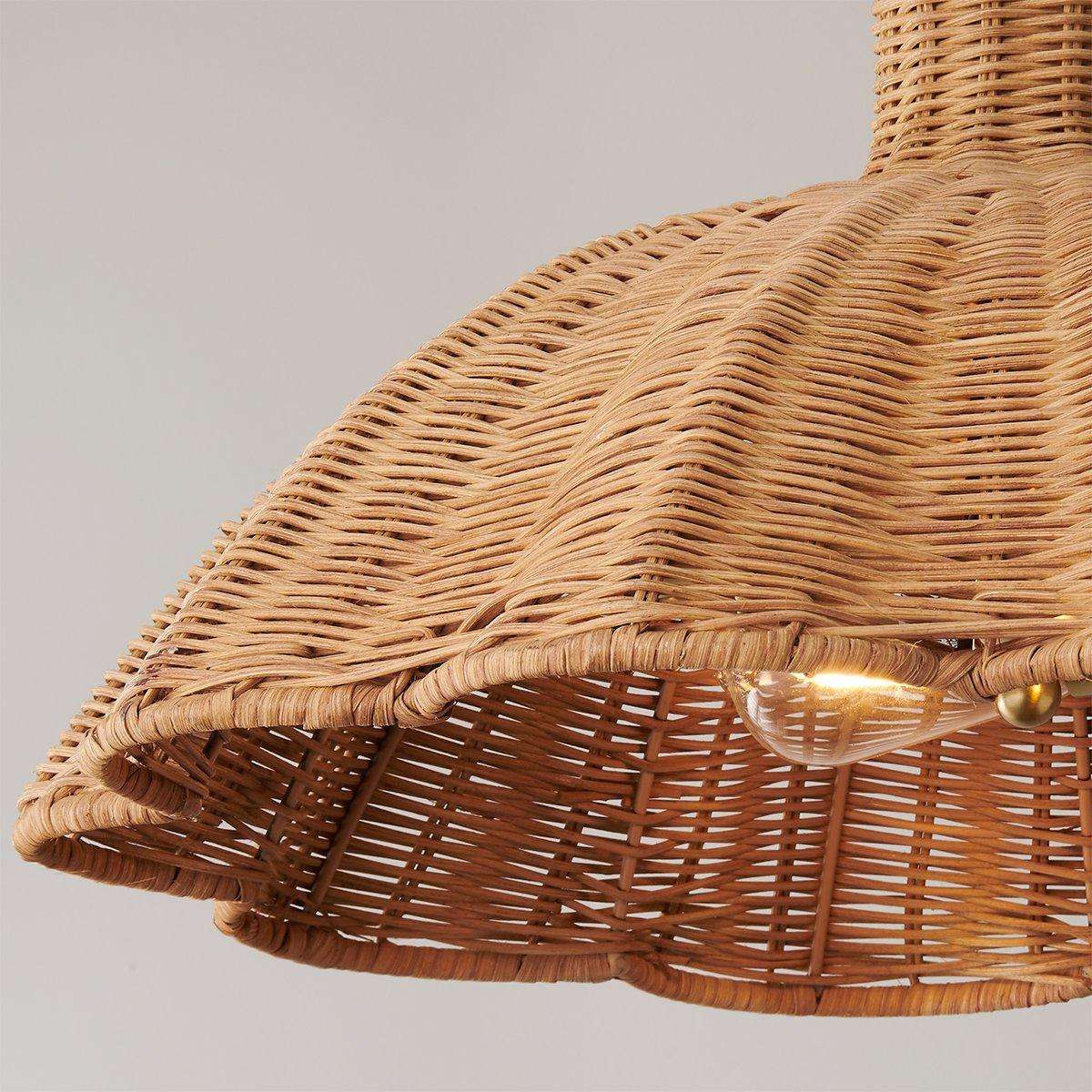 handwoven rattan pendant light with aged brass hardware