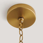 handwoven rattan pendant light with aged brass hardware