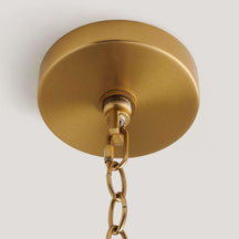 handwoven rattan pendant light with aged brass hardware