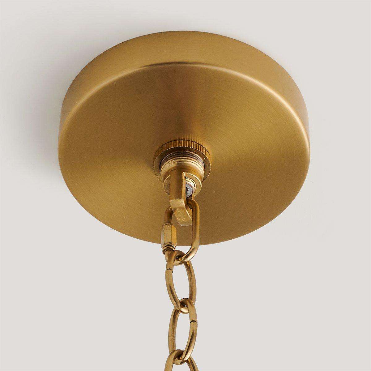handwoven rattan pendant light with aged brass hardware