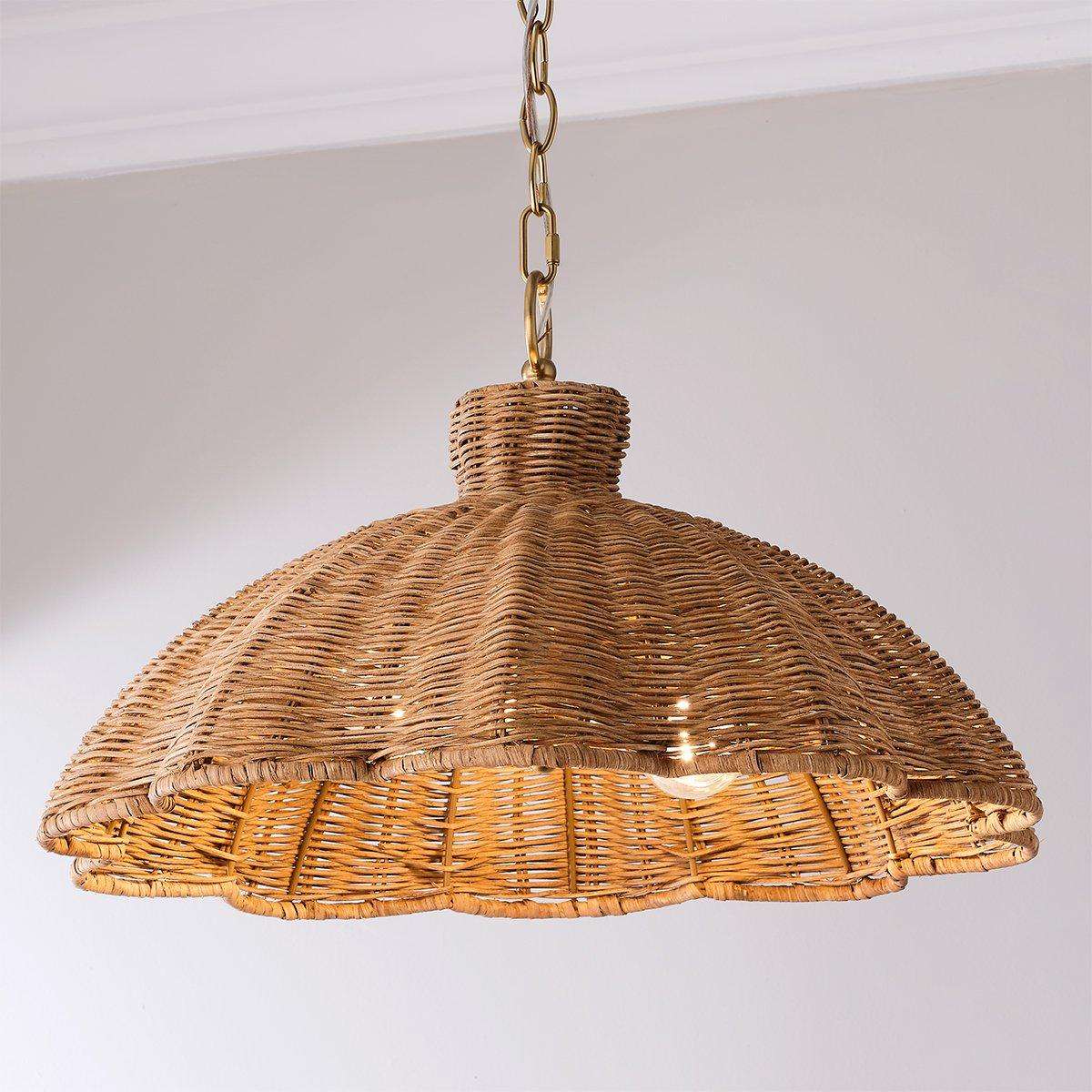 Handwoven rattan pendant light with aged brass hardware