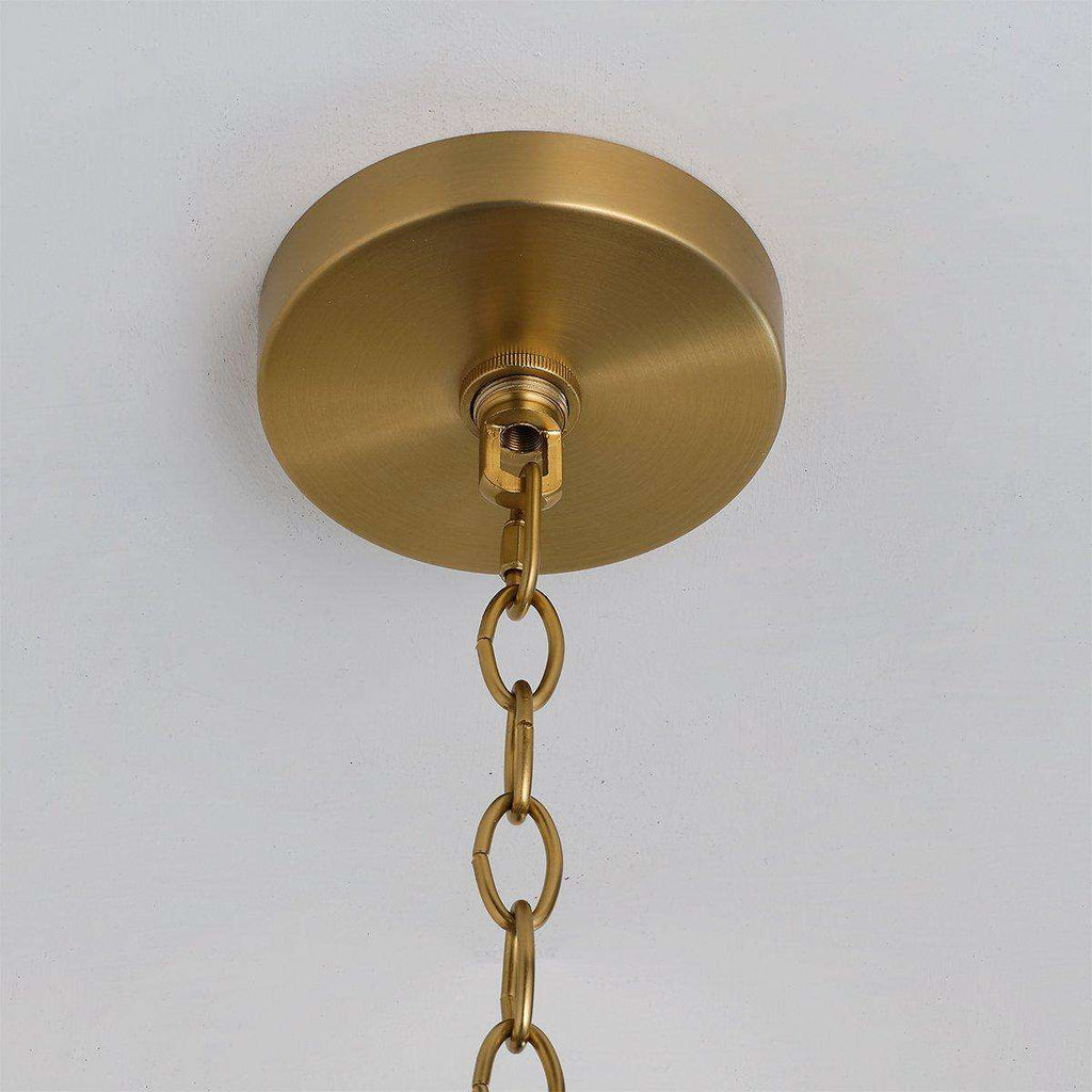 Handwoven rattan pendant light with aged brass hardware