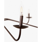 Philomena chandelier with sweeping arms and candle lights