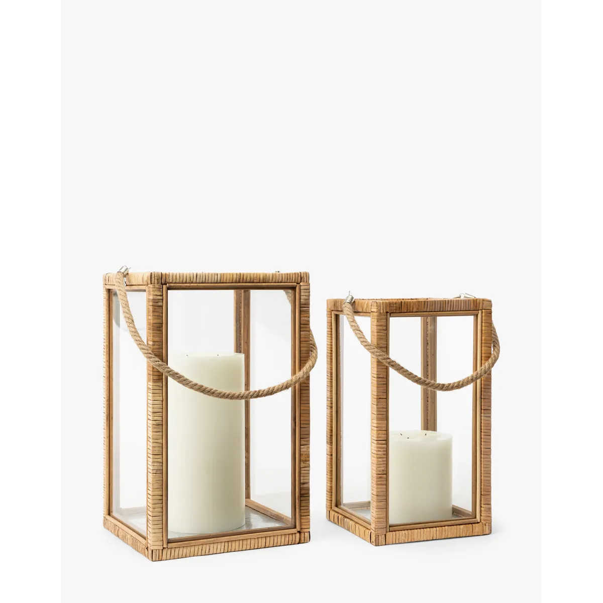 Rattan and Glass Lantern natural rattan frame clear glass panel lantern with warm even glow in bohemian living room interior