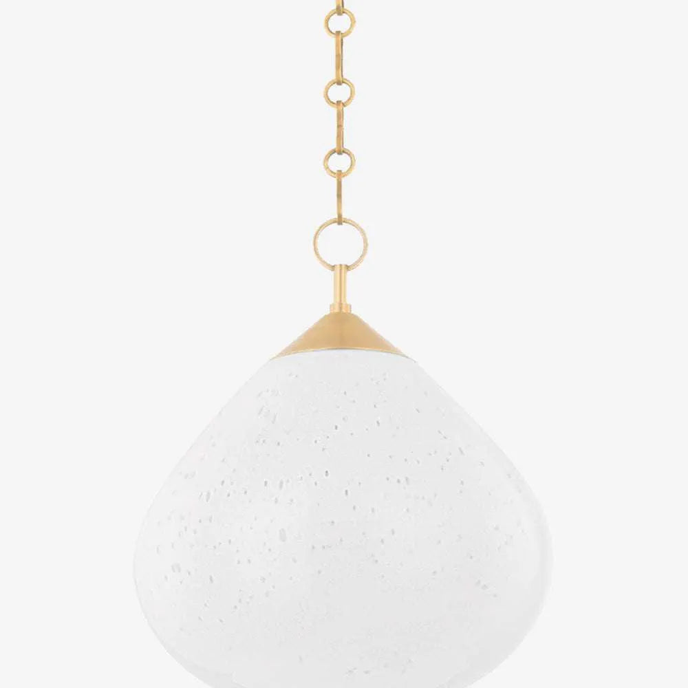 Semilla Pendant woven organic seed-form hanging light casting warm ambient glow over dining table