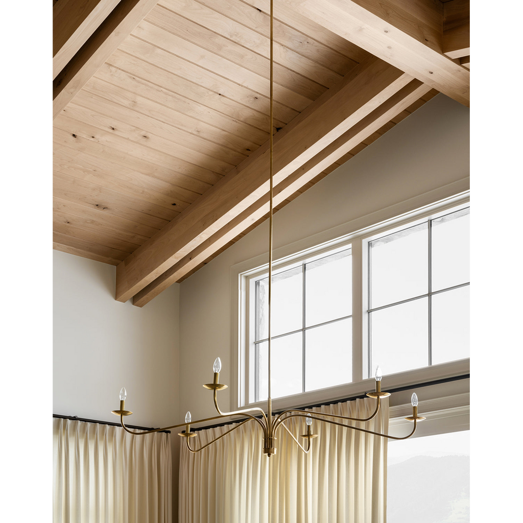 Philomena chandelier with sweeping arms and candle lights