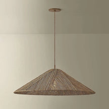 Woven Disc Pendant Light natural handwoven flat disc hanging light with warm dappled glow above dining table in bohemian interior
