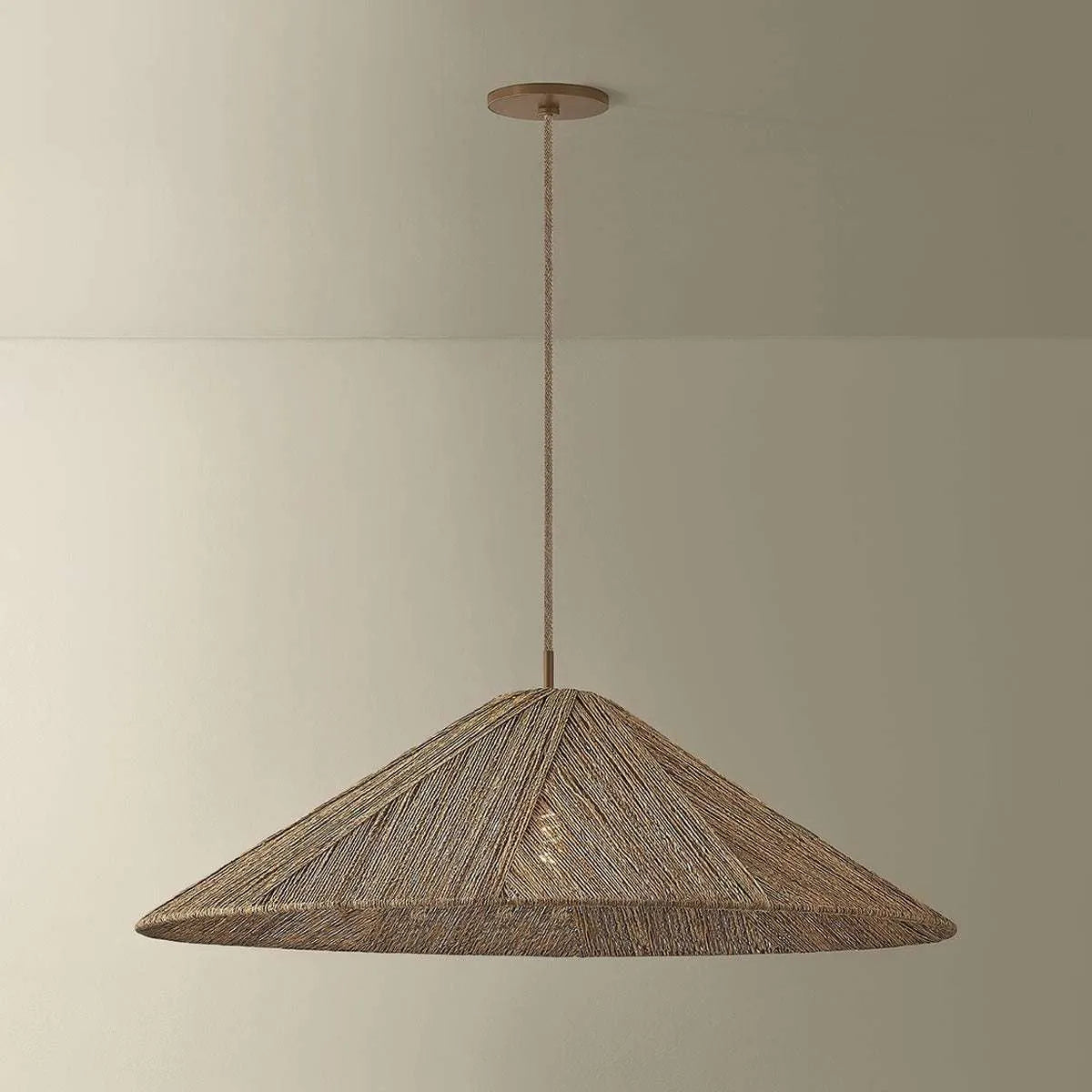 Woven Disc Pendant Light natural handwoven flat disc hanging light with warm dappled glow above dining table in bohemian interior