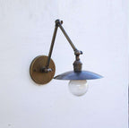 round brass wall sconce