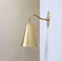 brass cylinder shade wall light