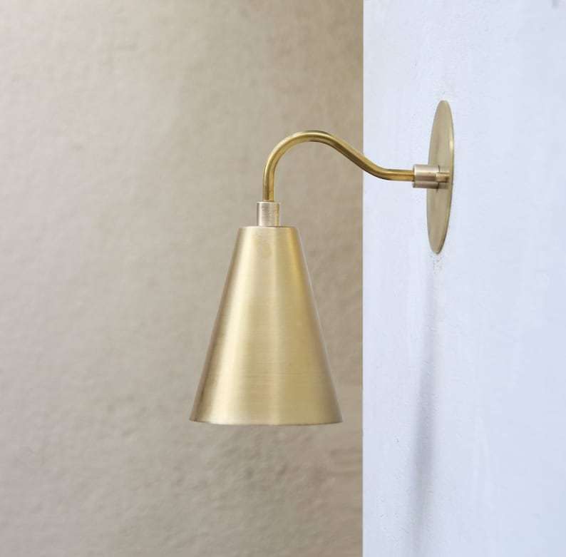 brass cylinder shade wall light
