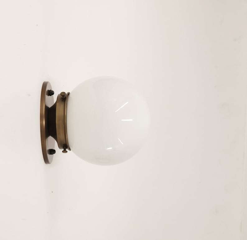 brass base wall sconce light