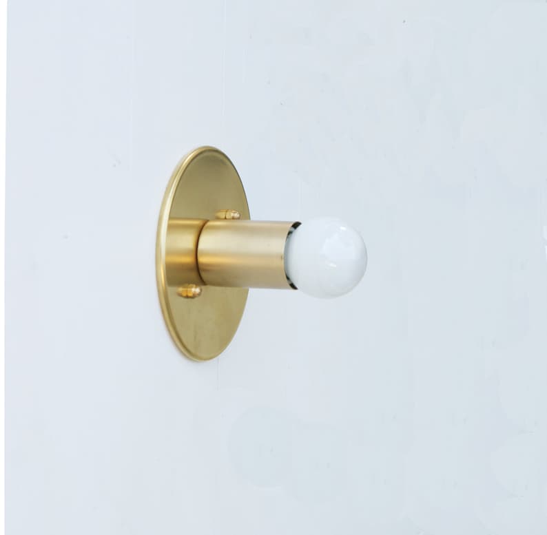 minimalist brass sconce