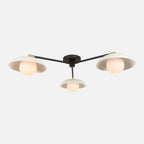 Delphine Glass Globe Triple Flush Mount three clear glass globe ceiling light with warm even glow in elegant bedroom interior