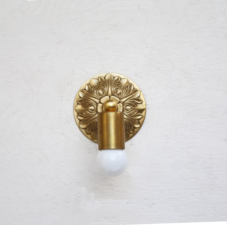 minimalist brass sconce