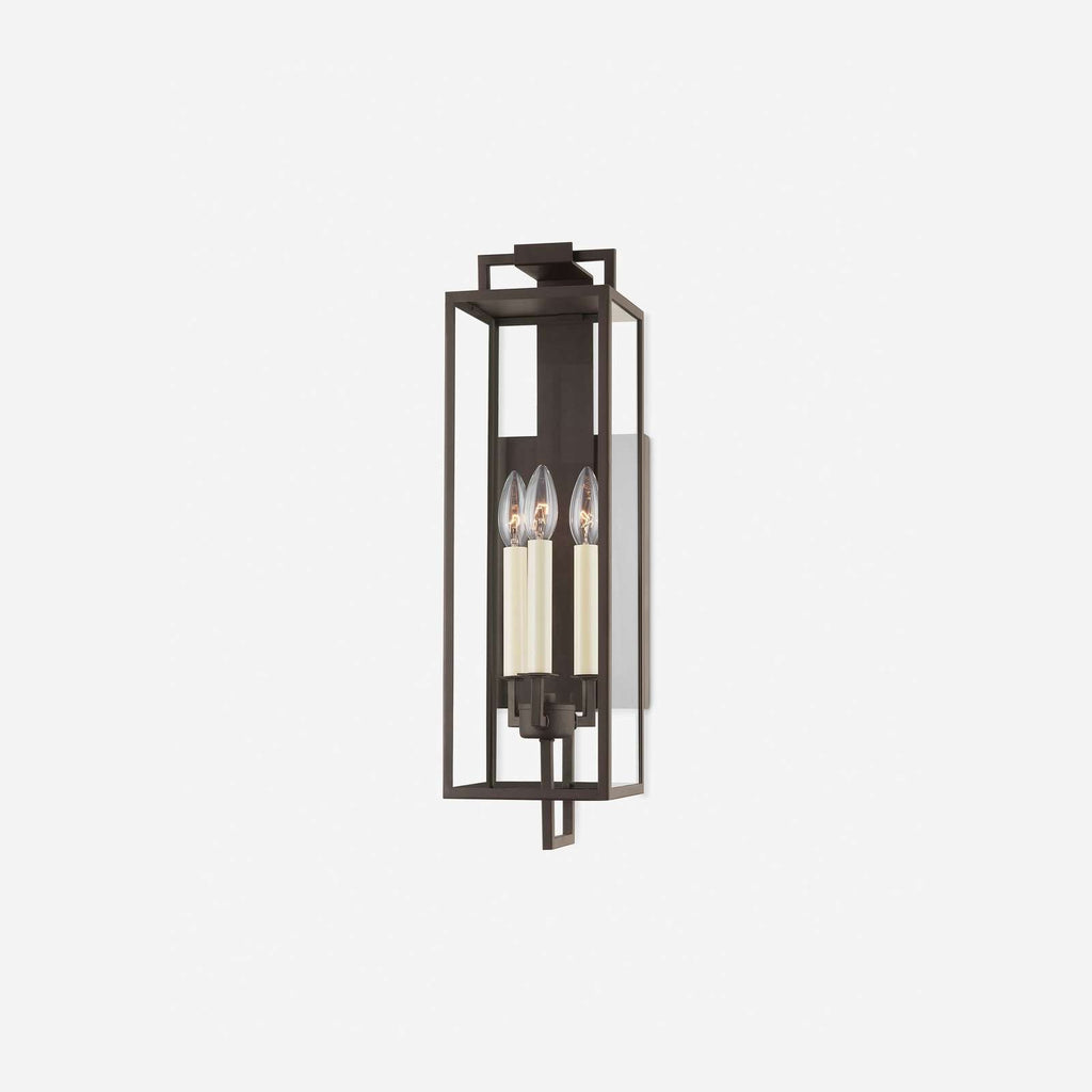 Judy Forged Iron Clear Glass Indoor Outdoor Lantern Sconce weather-rated wall light with warm classic glow mounted on porch exterior wall