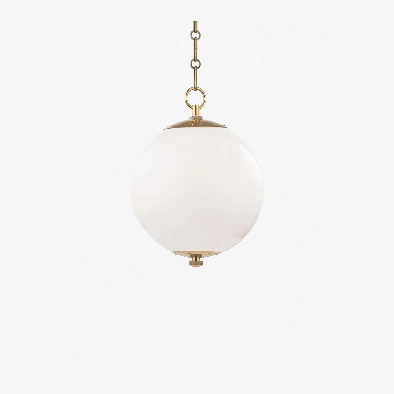 Kikki Aged Brass Opal Glass Globe Pendant milky opal sphere pendant light with patinated brass fitting and warm diffused glow above kitchen island