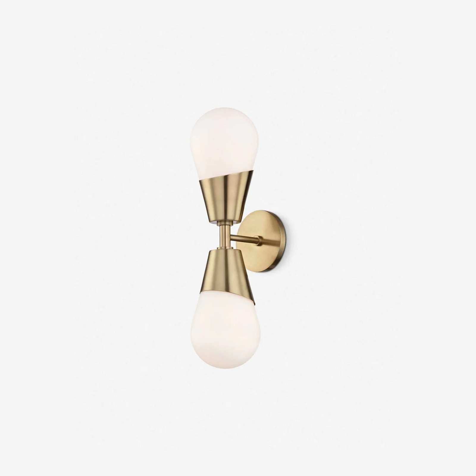 Prim Aged Brass Opal Glass 2-Light Wall Sconce heritage dual-globe patinated brass wall light with warm milky glow in elegant bedroom interior