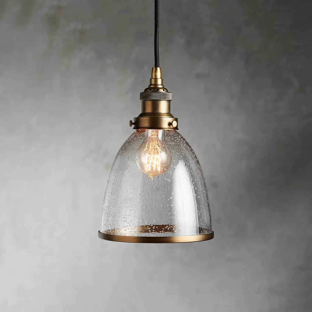 industrial cloche pendant in antiqued brass