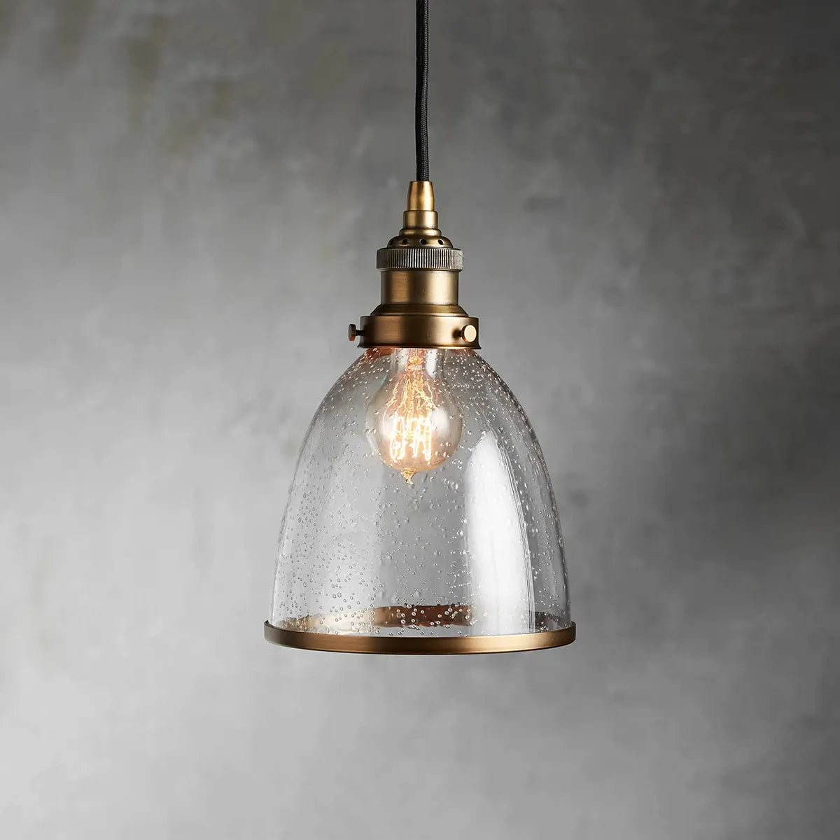 industrial cloche pendant in antiqued brass