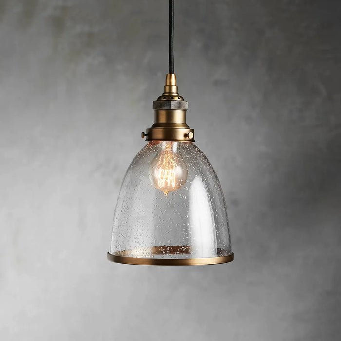 industrial cloche pendant in antiqued brass