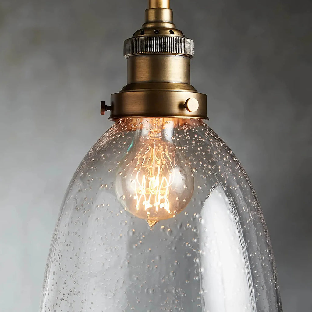 industrial cloche pendant in antiqued brass