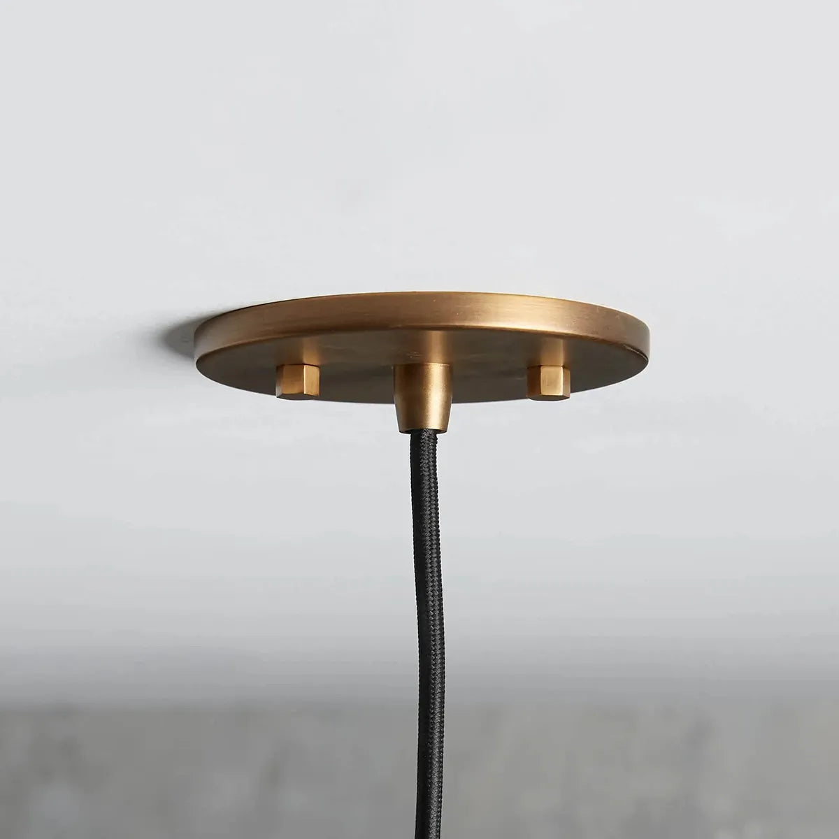 industrial cloche pendant in antiqued brass