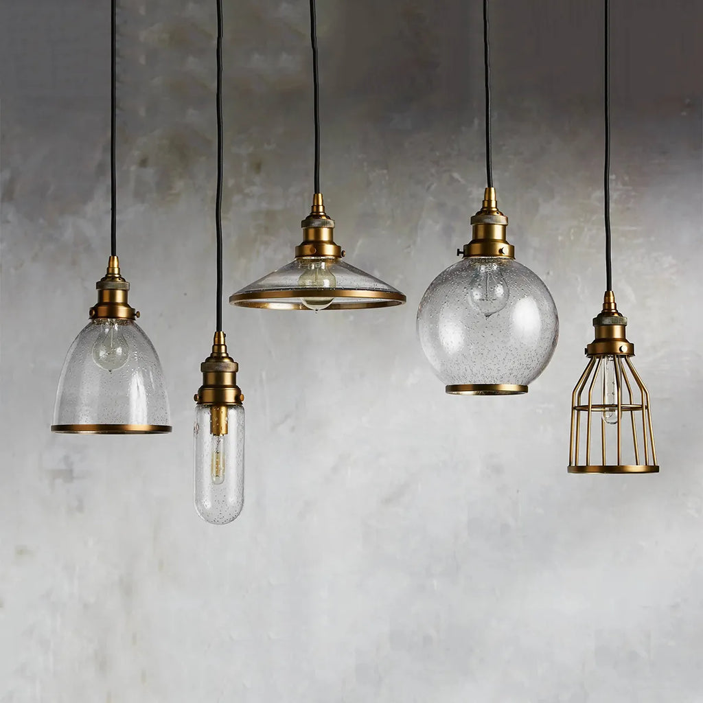 industrial cloche pendant in antiqued brass