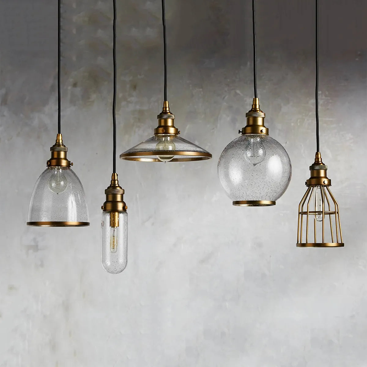 industrial cloche pendant in antiqued brass