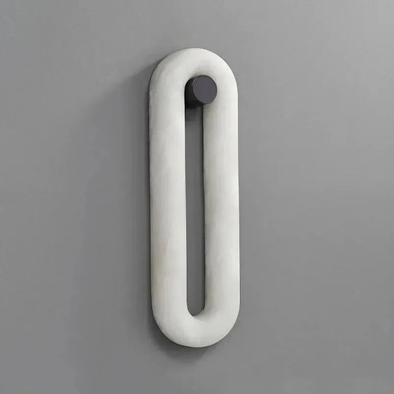 Alabaster elliptical wall lamp, switched off