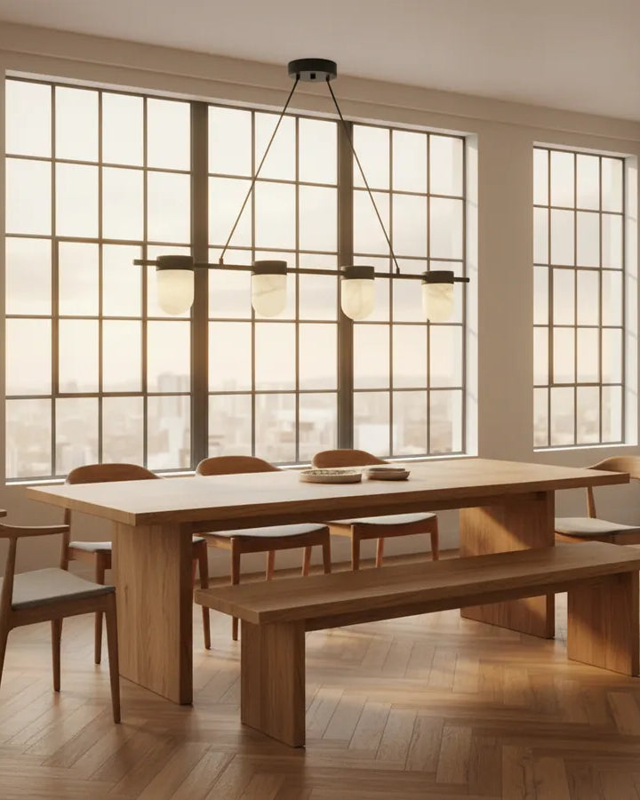 Linear chandelier over a long dining table