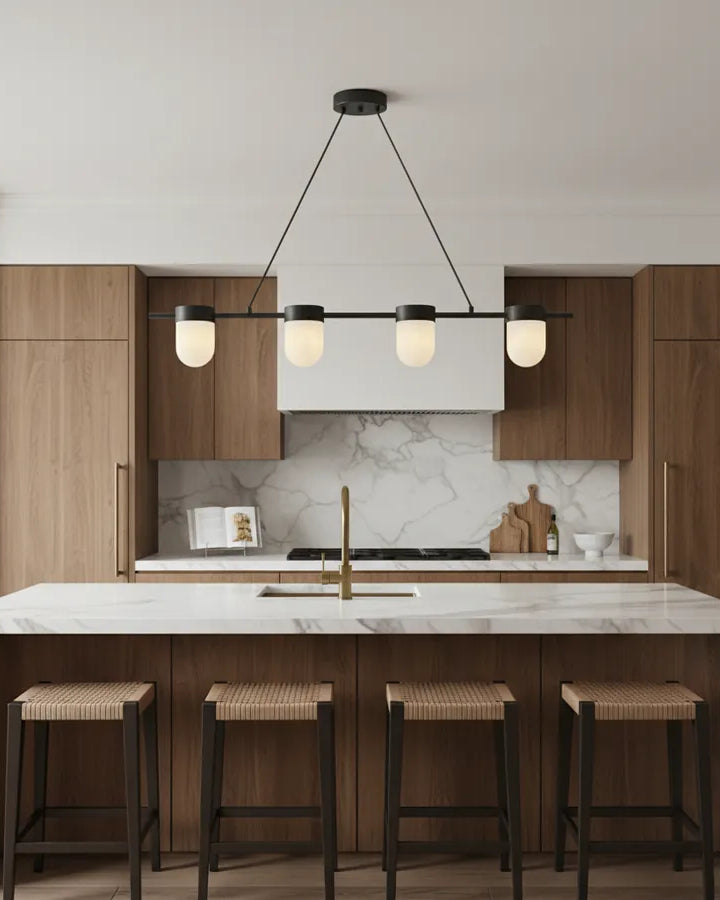 Linear alabaster chandelier over a kitchen island