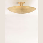 Kerris Perforated Disc Flush Mount Ceiling Light sculptural precision-perforated metal disc ceiling light with warm patterned glow in modern bedroom