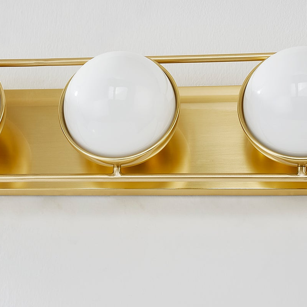 Lyra Aged Brass Globe Vanity Sconce - Warm Ambient Bathroom Light
