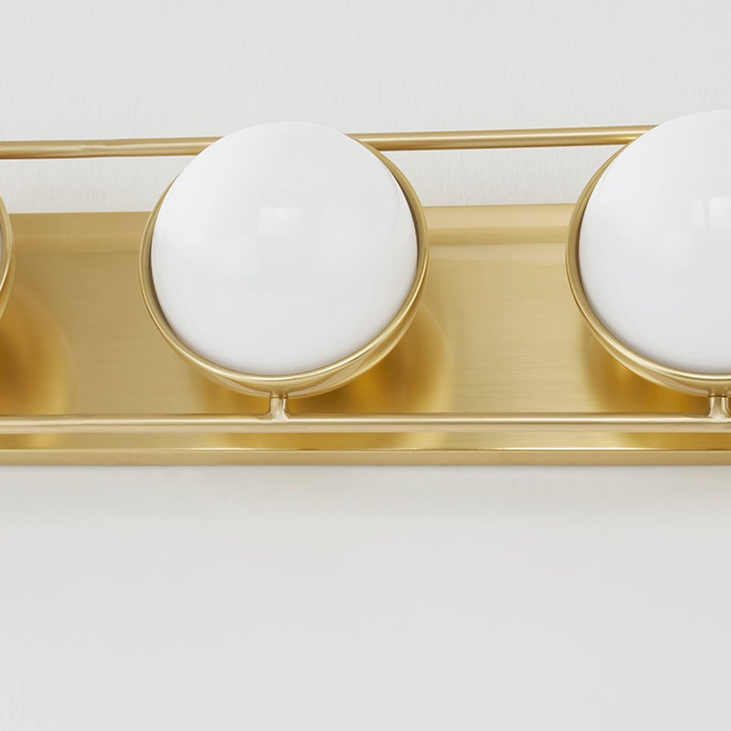 Lyra Aged Brass Globe Vanity Sconce - Warm Ambient Bathroom Light