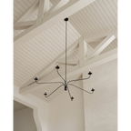 Philomena chandelier with sweeping arms and candle lights