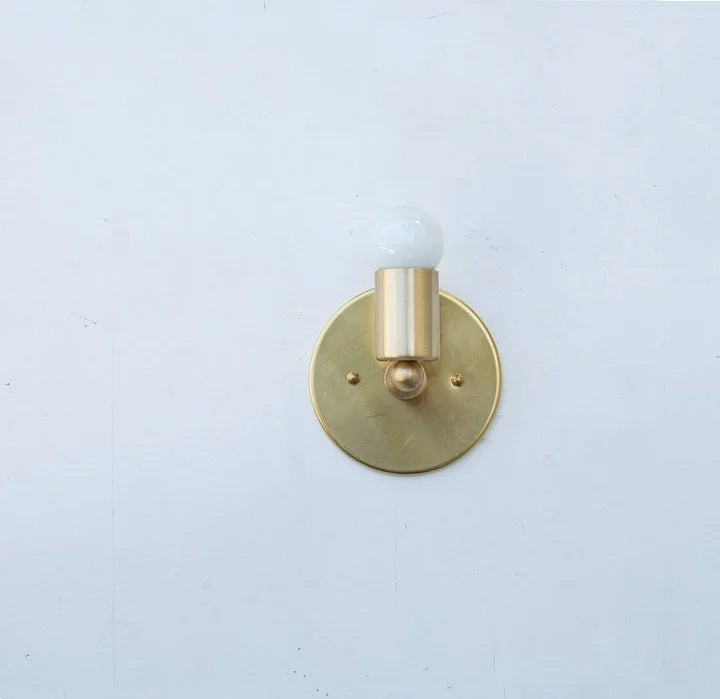 Mid century brass wall lamp, retro design for stylish, ambient lighting.