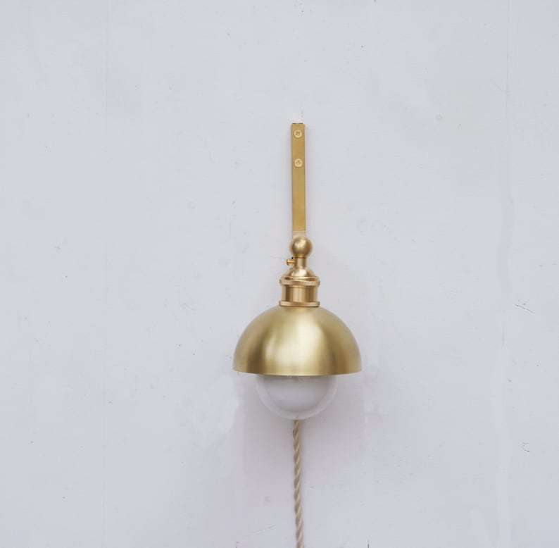 minimalist brass wall sconce