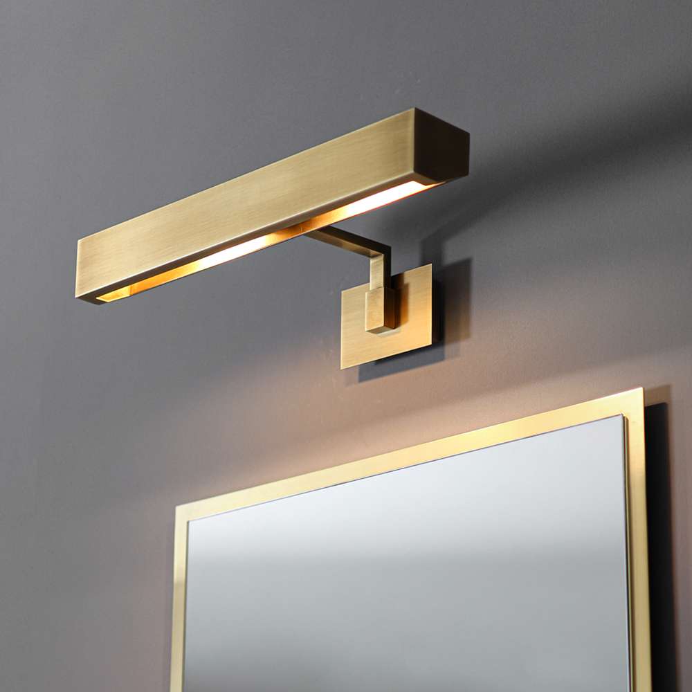 gold-accented mirror light design