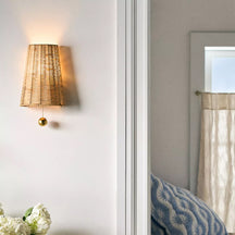 Naida Hand-Woven Rattan Wall Sconce with Aged Brass Pull
