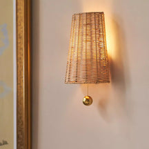Naida Hand-Woven Rattan Wall Sconce with Aged Brass Pull